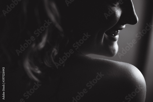 Woman smiling over shoulder © Brendan Louw