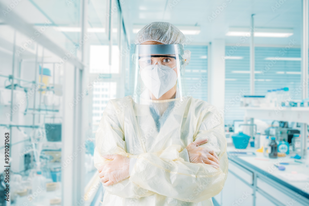 Female medical scientist posing in a lab Female medical scientist posing in a lab