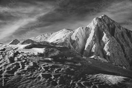 Winter alpine landscape in National Park Retezat, Carpathians, Romania, Europe. Snow covered moutains scenery