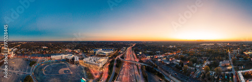 Sunset over highway leaving city
