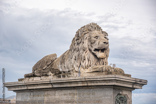 A statue of a reclining lion in Budapest, Hungary.