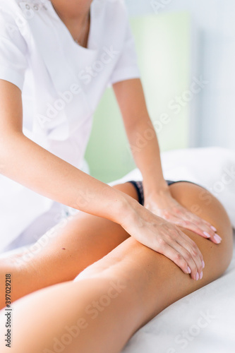Legs and buttocks massage to reduce cellulite and phlebeurysm and preserve an healthy look. Skin and bodycare, recovery © Olga