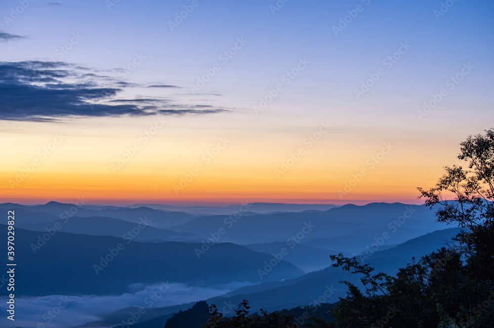 The mountains and tree were covered with morning light and the fog at Doi Samer Dao , Nan in Thailand