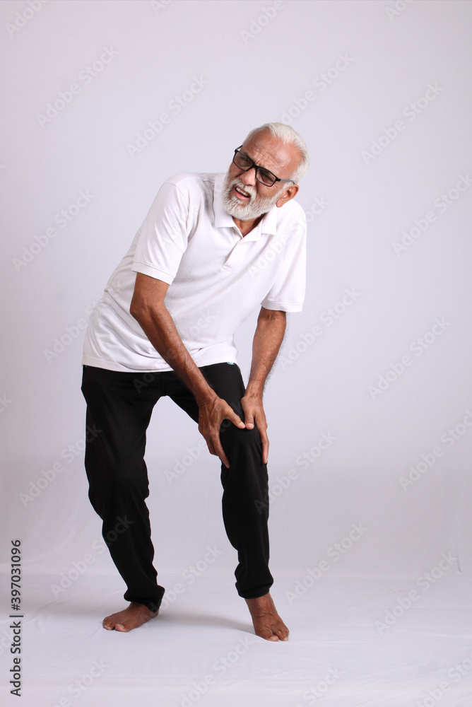 Indian asian old man having pain or ache sad expressions Indian asian old man having pain or ache sad expressions
