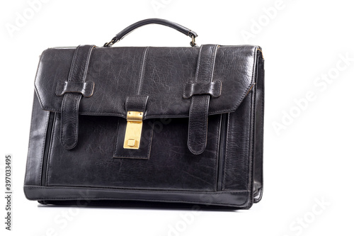 Studio lighting. on a white background an old shabby black briefcase. Close-up