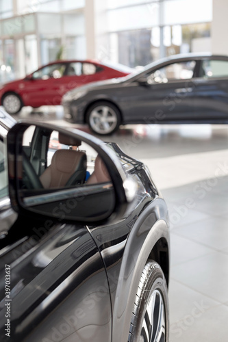 New modern cars on the blur background. Car auto dealership.