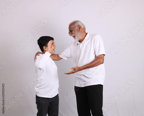 Happy Indian grandfather and grandson spending quality time