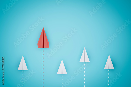 one red paper plane pointing in different way on blue background. Business for new ideas creativity and innovative solution concepts. 3D rendering