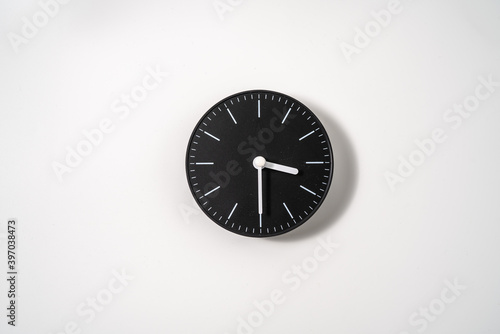 close up of an office clock on white background with clipping path