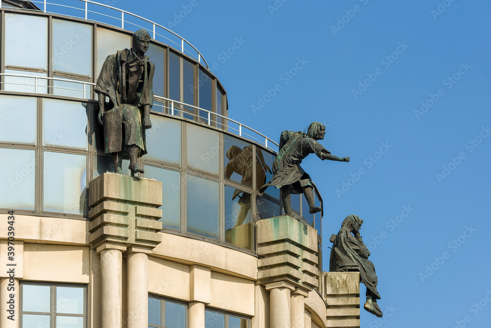 Statues on roof of the shopping center at the Zuid  South quarter in Ghent, Belgium