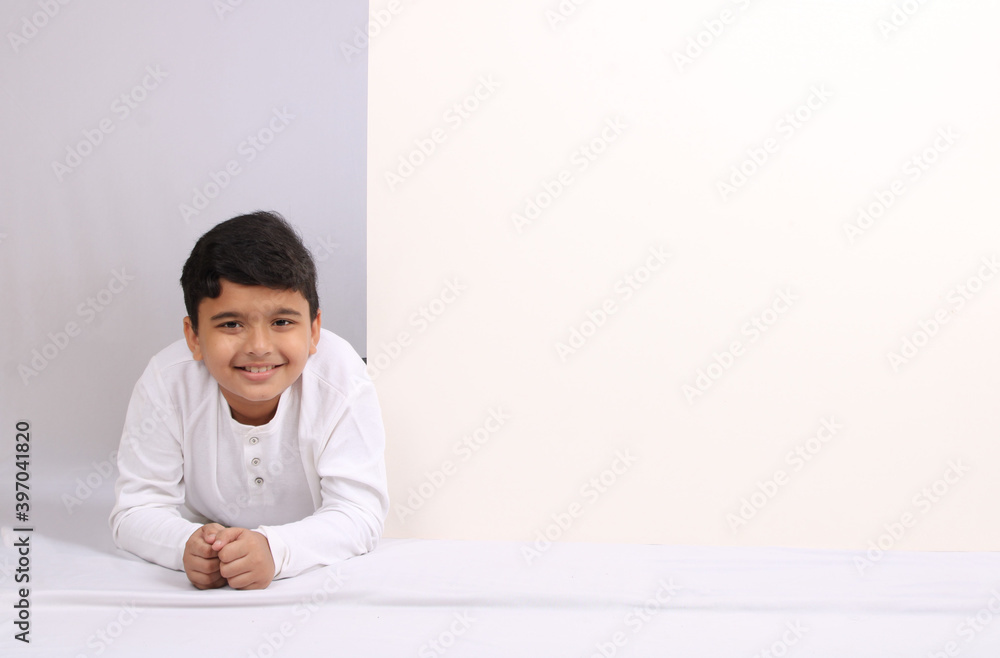 Young Indian schoolboy showing blank copy space. Young Indian schoolboy showing blank copy space.