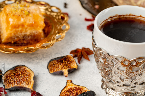 Cup of coffee and turkish pastries on dark surface © fotofabrika