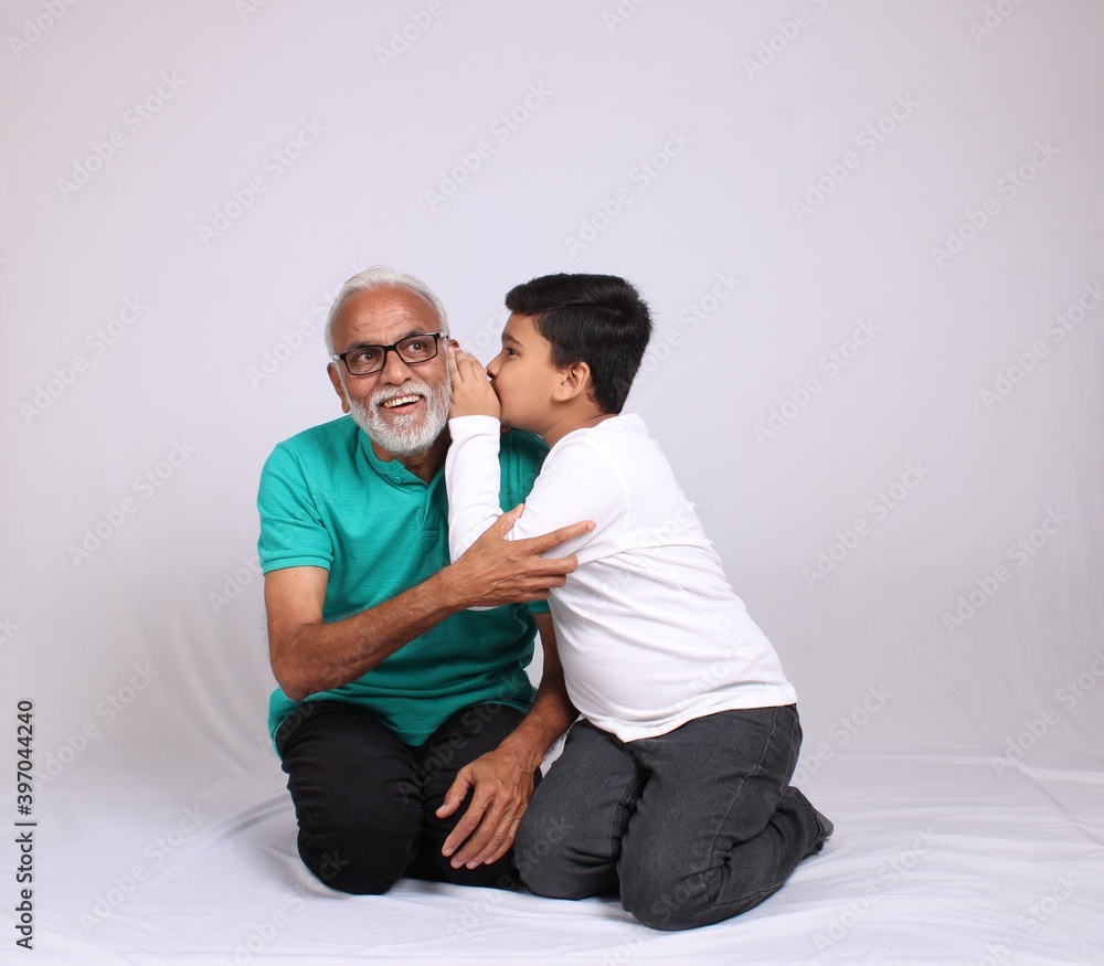 Happy Indian grandfather and grandson spending quality time Happy Indian grandfather and grandson spending quality time