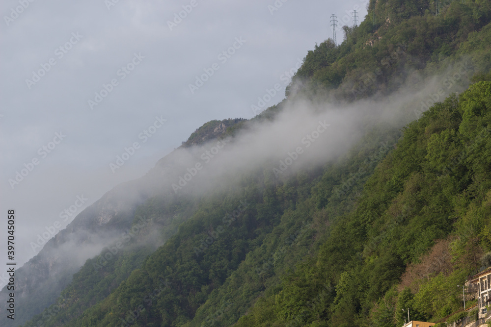 Fog in the mountains near Argegno village on Como lake.