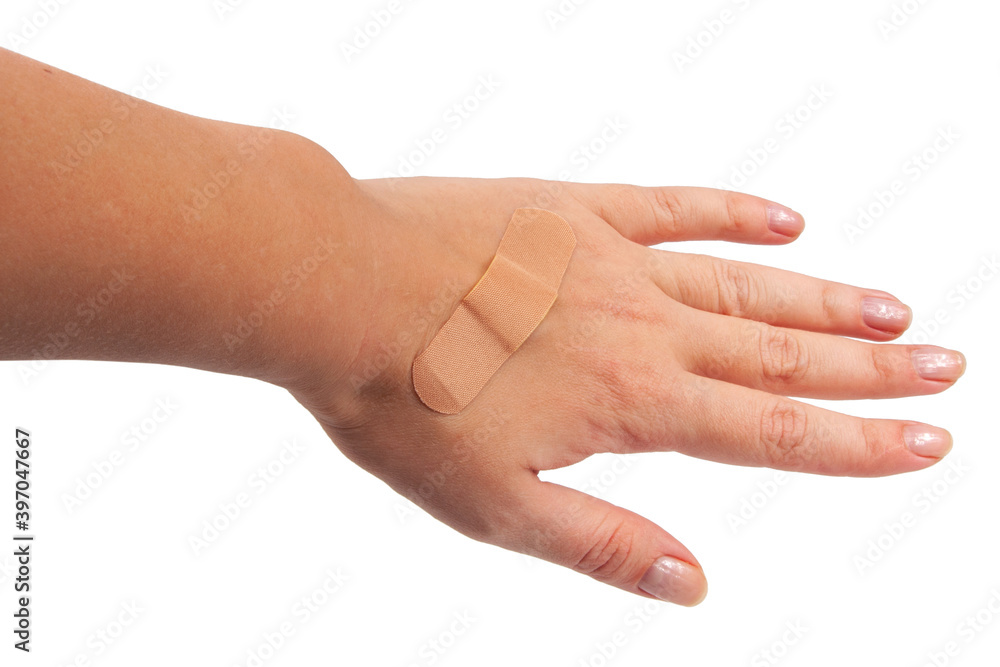 Medical patch plaster on hand isolated on the white Medical patch plaster on hand isolated on the white