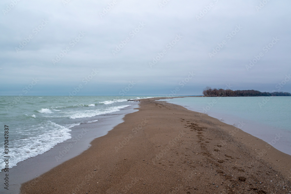 A view from near the southern tip of Canada, looking back towards the mainland at Point Pelee National Park on a gloomy day.