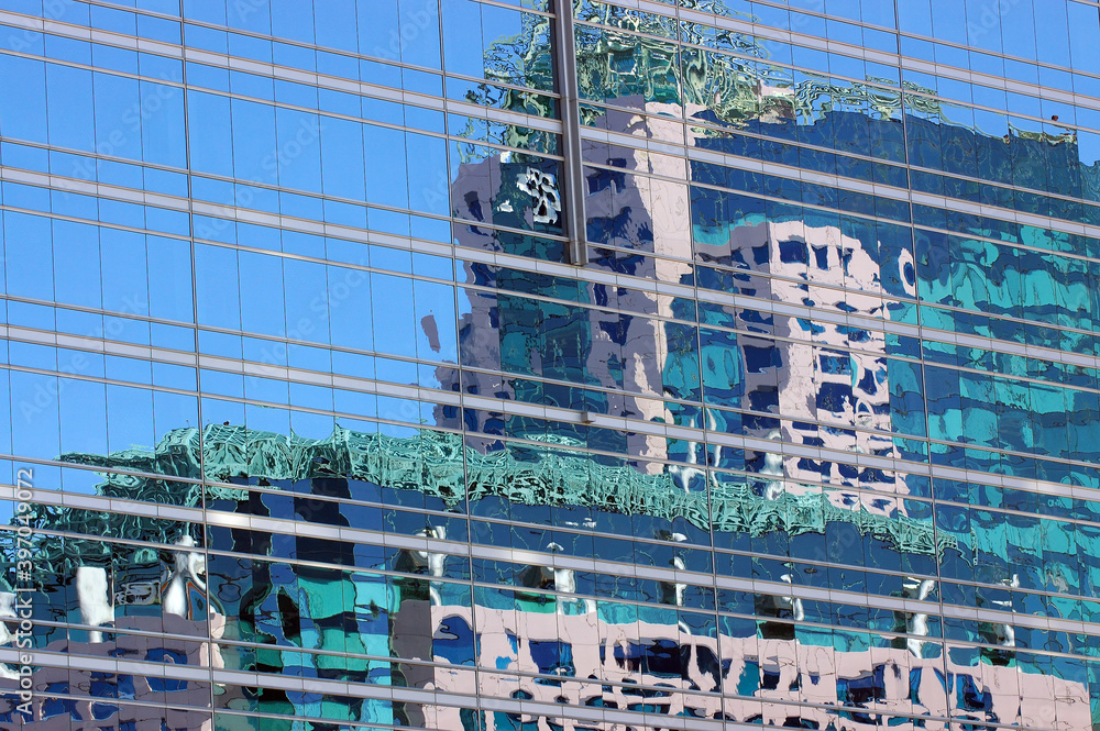 Toronto Metro Hall reflected in glass building Toronto Metro Hall reflected in glass building