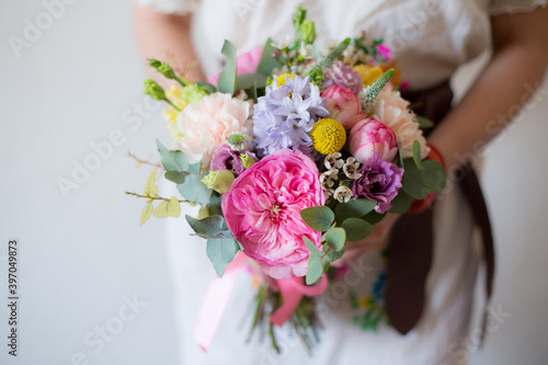 Amazing spring flower bouquet with garden roses  Veronica  craspedia  waxflower  carnations and eucalyptus