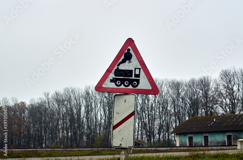 a warning sign before a railway crossing