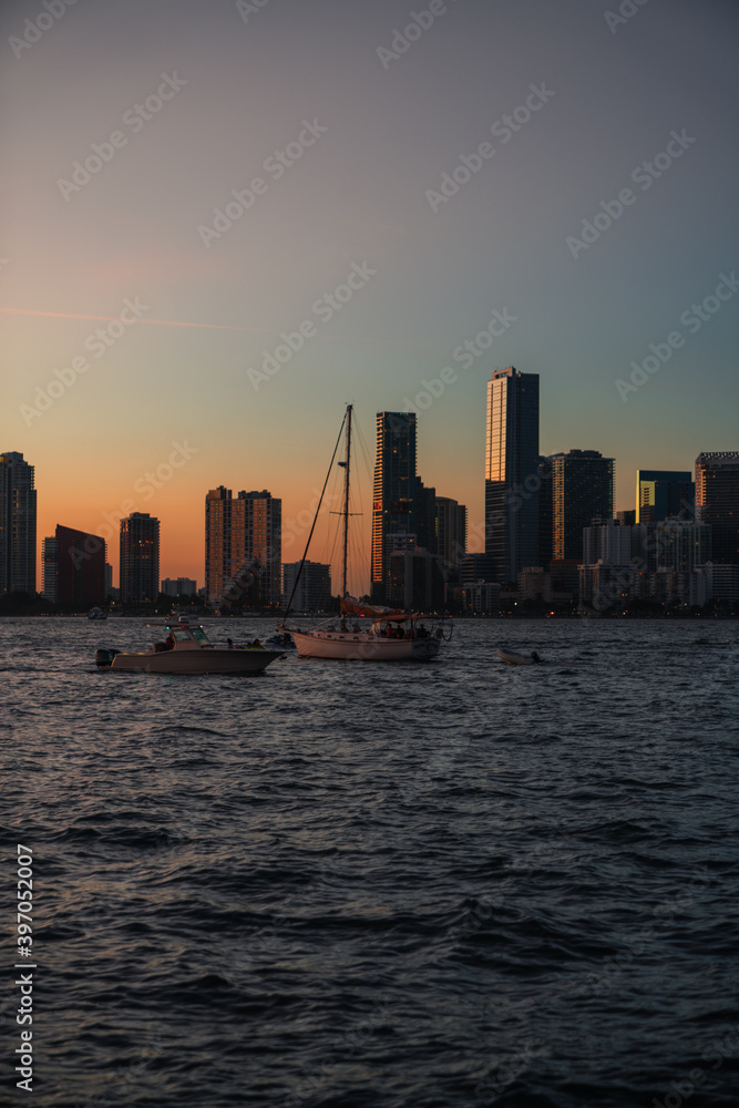 city skyline at sunset boats florida 