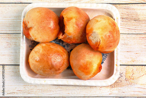 Ration of preñaos buns on rustic wooden table