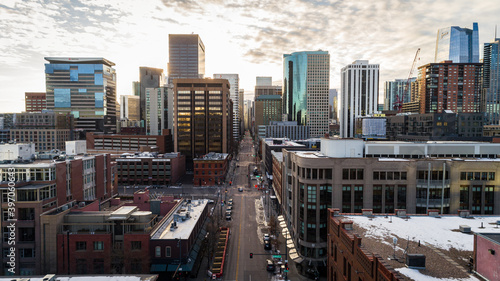 "Denver, CO USA - 11-29-2020: Epic drone shot leading through the heart of downtown Denver on 17th st." © Noah Densmore