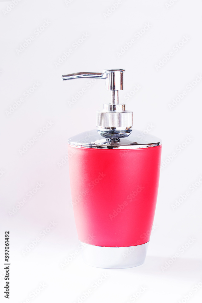 Obraz premium Red plastic and metal bottle packing of sanitizer, antiseptic with dispenser for hygienic, fluid, cosmetic, liquid, sanitary soap, gel and detergent isolated on white background. Soap Pump Bottle.