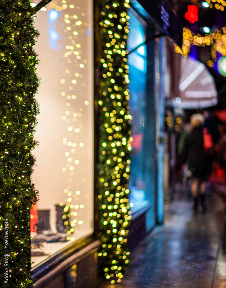 Light night bokeh city blur. Christmas illumination. Festive Christmas fair, winter, new year concept. Abstract background.