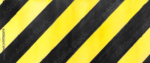 Safety stripes on construction site, Black and yellow Under construction sign over a grunge texture, top view © sosiukin
