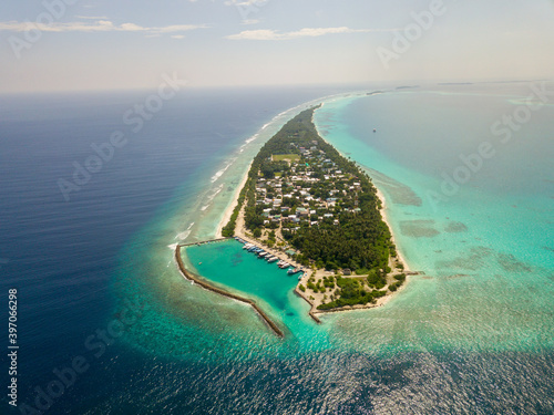 Aerial spherical panorama of tropical paradise beach on tiny Maldives island Dhigurah in Ari Atoll. Turquoise ocean, white sand, coconut palm trees. photo