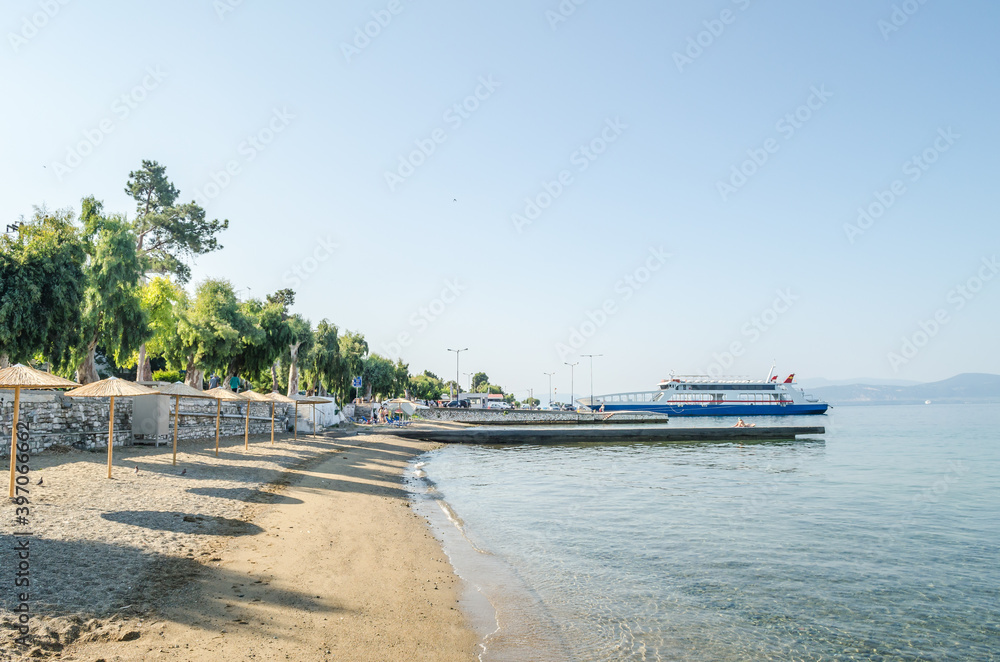 Reed umbrellas on the beach of the island of Evia-Greece 