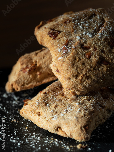 Three sweet bread cakes on a black background, typical sweet in some areas of Spain that is made in autumn photo