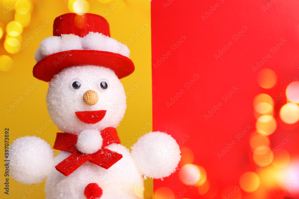 Cute snowman on color background, bokeh effect. Space for text