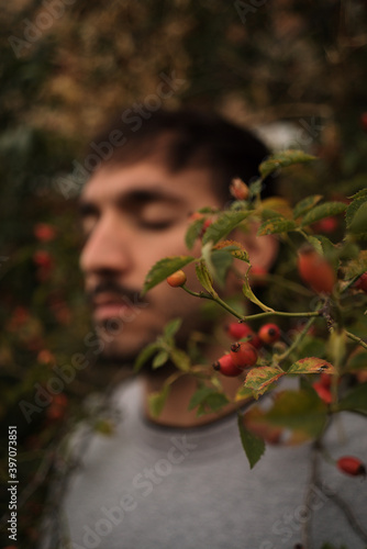 man with red berries