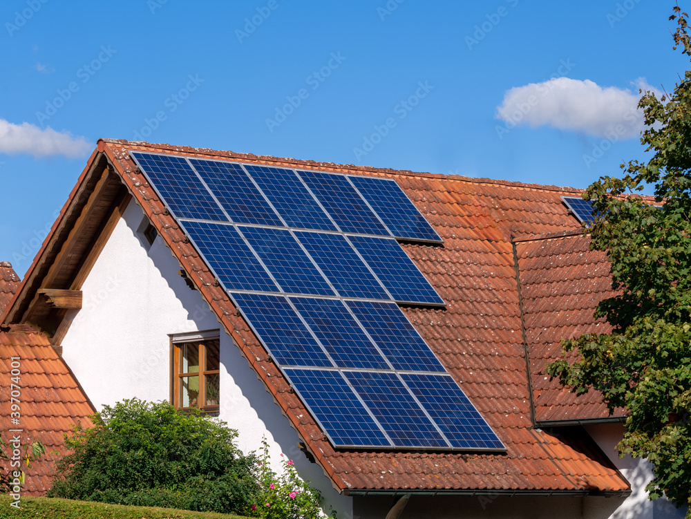 Fototapeta premium Generic house (modified by image editing) with photovoltaic system