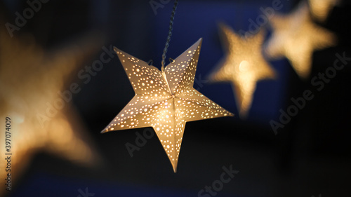 decorations for the holiday. white paper stars.background for Christmas and new year holidays.