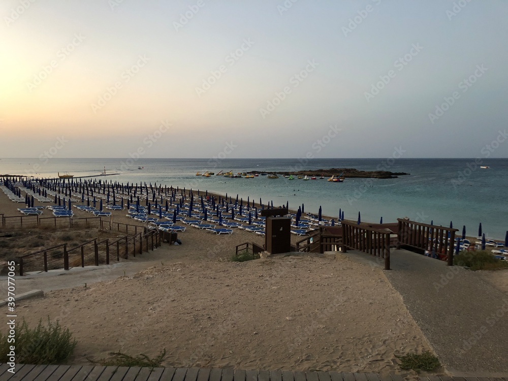 Fototapeta premium the beach of Fig tree bay. sunset on the sea. Cyprus. the Mediterranean sea
