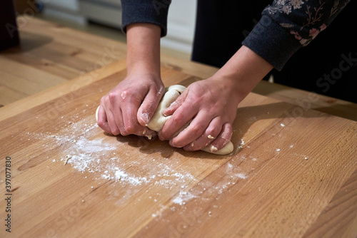 Closeup of female hands baking