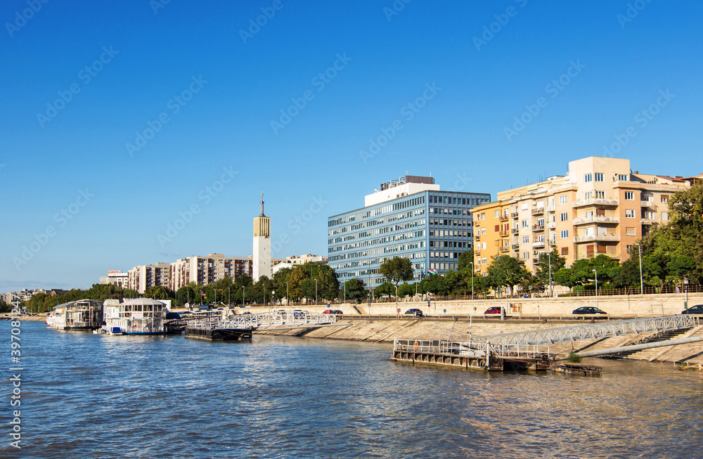 Naklejka premium View of Budapest embankment wit ancient and modern buildings on the river Danube in Hungary in a beautiful summer day