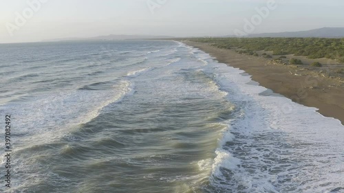 Wild and deserted beach along Maremma sea coast aerial view