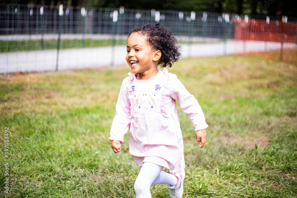 Young toddler running and enjoys the outdoors Young toddler running and enjoys the outdoors