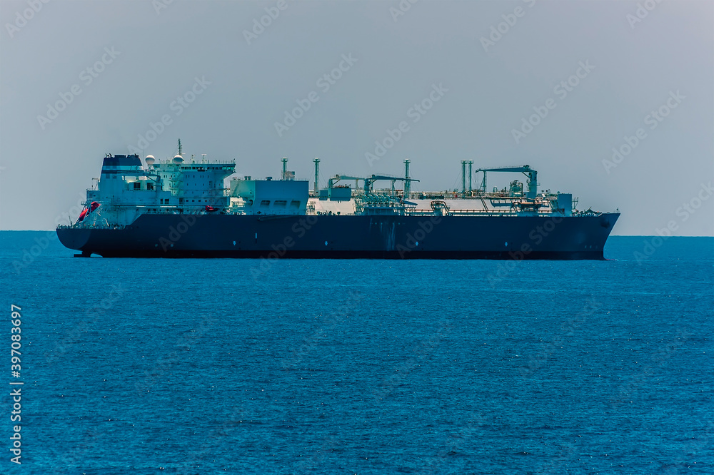 A lightly laden bulk carrier at sea approaching the Singapore Straits in Asia in summertime