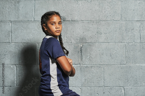 Studio soccer portrait young girl