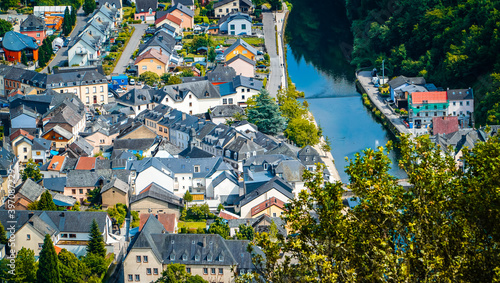 The picturesque medieval fairy tale looking town of Vianden in Luxembourg with the river