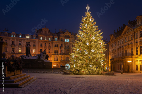 Christmas tree and the Old Town Square in Prague, Czech Republic, covered by fresh snow. No Christmas markets organized in 2020 due to Covid-19