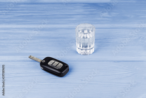 a glass of vodka and car keys photo