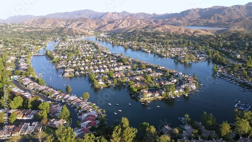 Aerial over homes, lakes in the wealthy Los Angeles suburb neighborhood of Westlake Village, California. photo