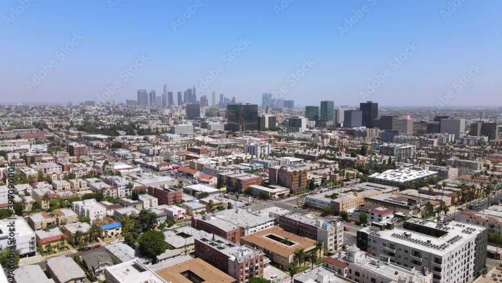 Rising aerial from middle class area near Hollywood, California with downtown Los Angeles in distance. Rising aerial from middle class area near Hollywood, California with downtown Los Angeles in distance.