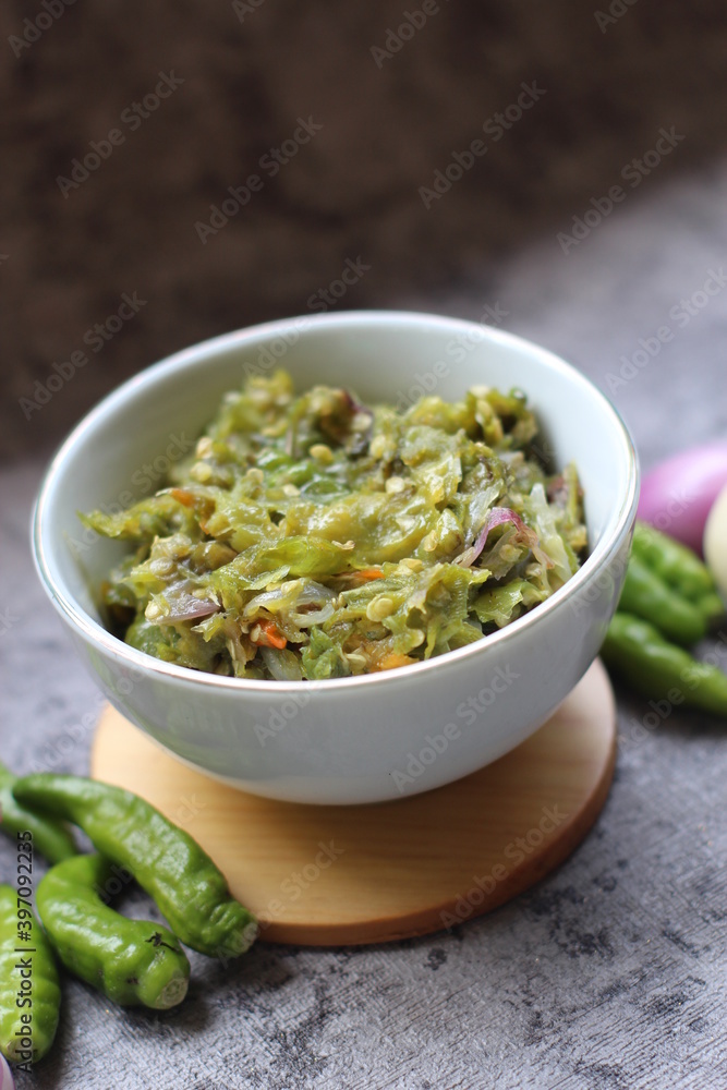 Sambal ijo Or Green chili sauce with ingredients, Greem chilies, onion, garlic, and salt Sambal ijo Or Green chili sauce with ingredients, Greem chilies, onion, garlic, and salt