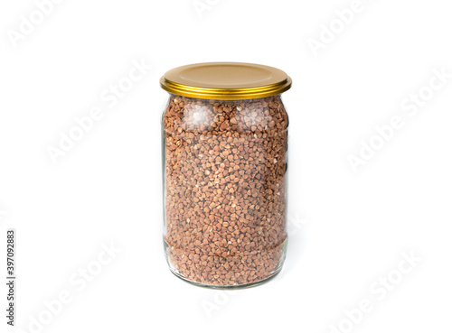 Bank with buckwheat on a white background. Side view with space for copying. Grocery background.
